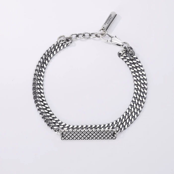 Bracciale multichain pallinata e groumette con piastra