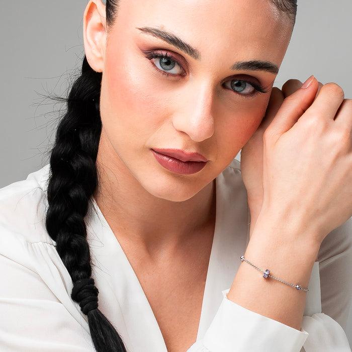 BRACCIALE DONNA IN ACCIAIO, BUSSOLOTTO ED ELEMENTI CON ZIRCONI VIOLA