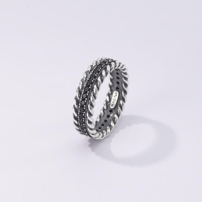 Anello torchon e pietre nere