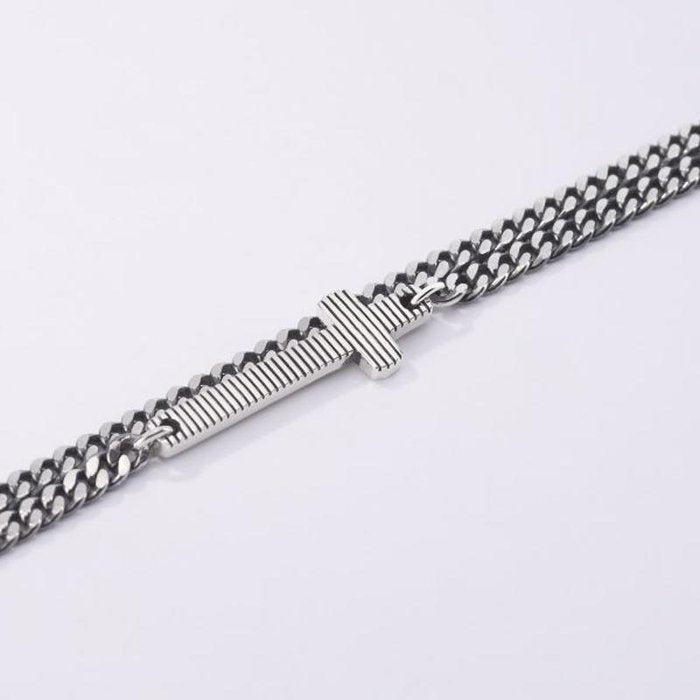 BRACCIALE MULTICHAIN GROUMETTE CON CROCE RIGATA