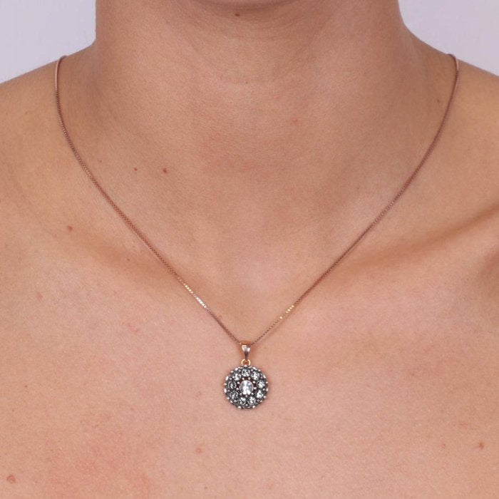 Collana in Argento 925 con pendente a forma di fiore con cristalli fume' e bianchi