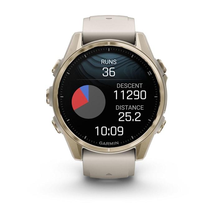 Fēnix® 8 - 43 mm, AMOLED, Sapphire, Soft Gold con cinturino  Fog grey/dark sandstone in silicone