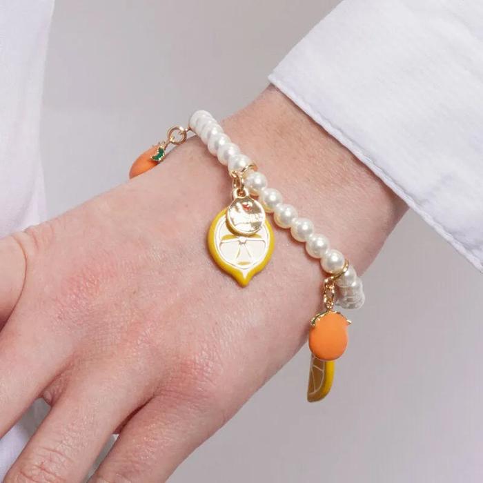 Bracciale in Metallo elastico di perline cn limoni e arance