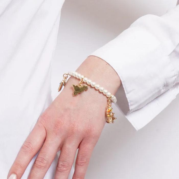 Bracciale in Metallo elastico con sfere bianche e ciondoli