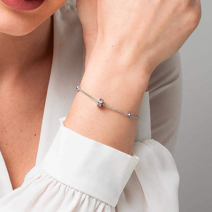 BRACCIALE DONNA IN ACCIAIO, BUSSOLOTTO ED ELEMENTI CON ZIRCONI VIOLA