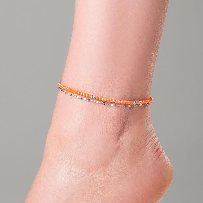 CAVIGLIERA DONNA IN ACCIAIO CON CRISTALLI ARANCIONI