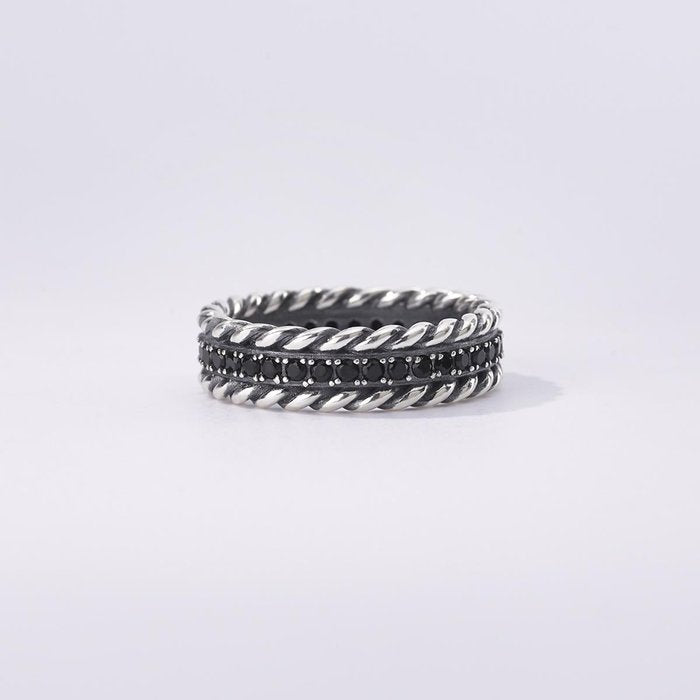 Anello torchon e pietre nere