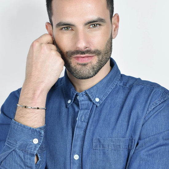 BRACCIALE UOMO IN ACCIAIO CON PIETRE NERE ED ELEMENTI IP GOLD